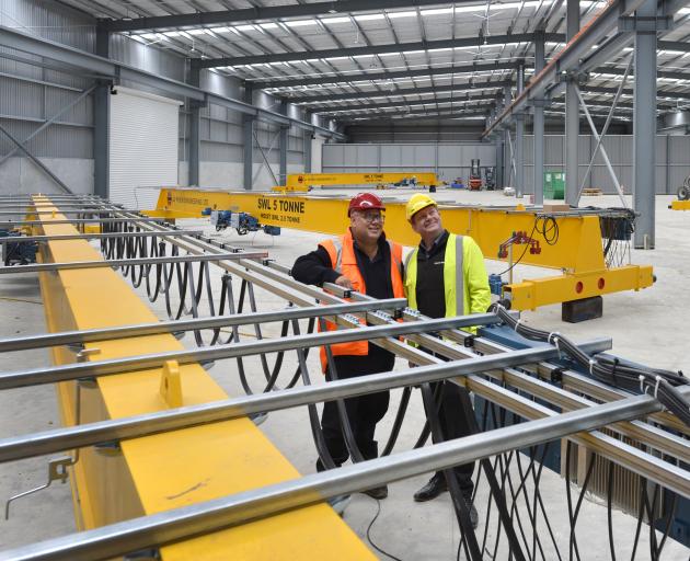 Dimond Roofing area sales manager Chris Silcock (left) inspects the new Fletcher Steel building...