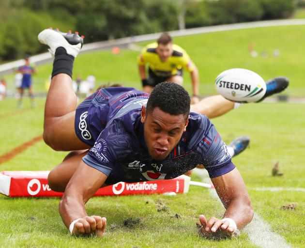 Warriors wing David Fusitu'a dives over to score a try during a trial match against the Melbourne...