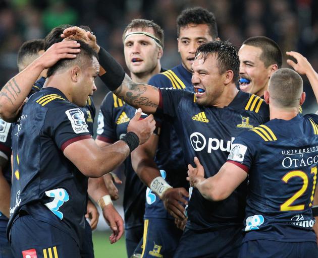 The Highlanders forward pack celebrate a job well-done over a much lauded Crusaders pack. Photo:...
