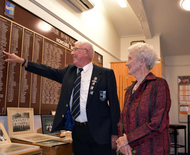 Bill Grey points to his name on the honours board while inspecting some of the memorabilia with...