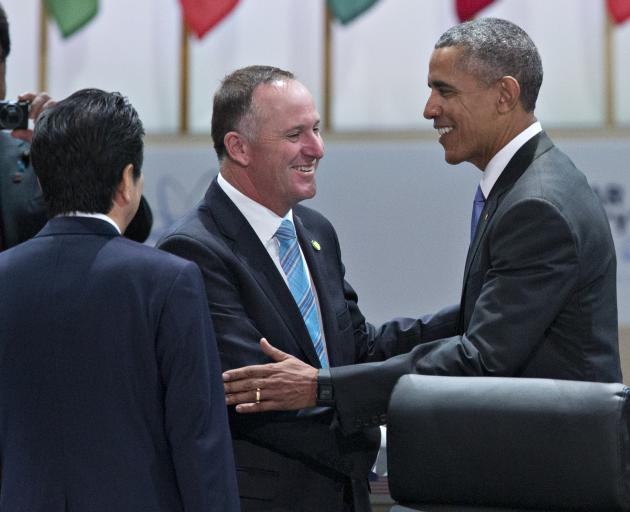 Barack Obama shakes hands with John Key during a Nuclear Security Summit in 2016. Photo: Getty Images