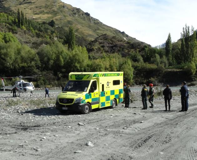 A Lakes District Air Rescue Trust helicopter prepares to take off from a beach at Arthurs Point,...