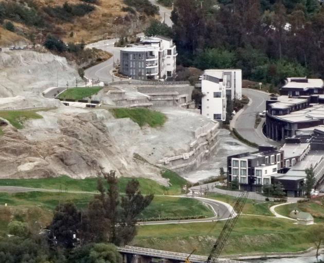 The Terraces Hotel will straddle the anchored rock face at the centre right of this photo of the Kawarau Falls site, across Alpine Lakes Dr from the DoubleTree (below right) and Hilton Queenstown (above right) hotels. Photo: ODT files