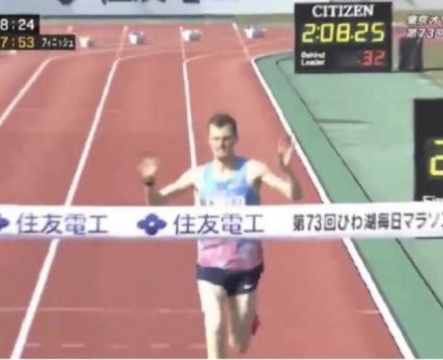 Jake Robertson crosses the line in Lake Biwa. Photo: Twitter