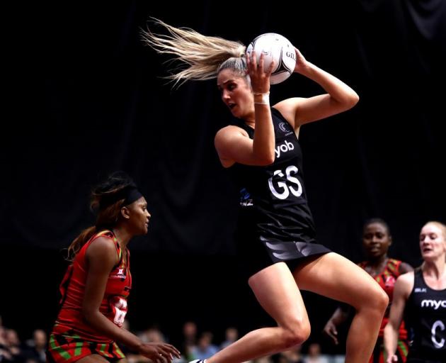 Te Paea Selby-Rickit takes a pass during the Silver Ferns' win over Malawi last night. Photo:...