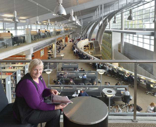 University of Otago associate librarian Maureen Miller relaxes in the Central Library, which has...
