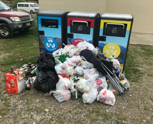 Rubbish that cannot fit into the new BigBelly bins at the Lowburn freedom camping site near Cromwell is piled up around them. Photo: Supplied