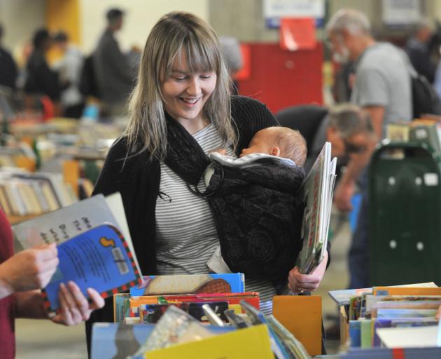 Bryony Harrison and son Aurelius Yates, of Dunedin, search for bedtime reading at the Dunedin...