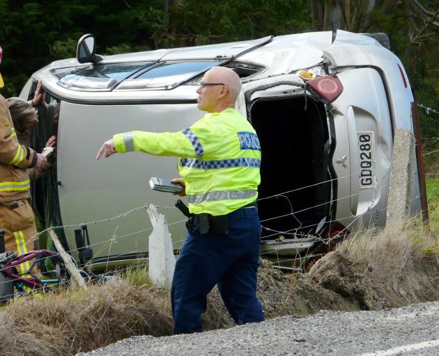 Emergency services attend a single-vehicle crash at the intersection of Stony Creek Rd and SH1 north of Balclutha yesterday morning.Emergency services attend a single-vehicle crash at the intersection of Stony Creek Rd and SH1 north of Balclutha yesterday