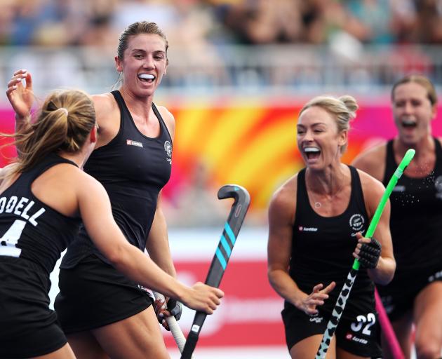 Brooke Neal of New Zealand celebrates scoring a goal during the Pool B Hockey match between New...