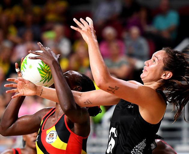 Stella Nanfuka of Uganda and Ameliaranne Ekenasio of New Zealand compete for the ball during the...