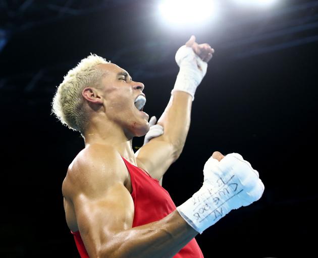 David Nyika celebrates winning the gold medal at the Commonwealth Games on the Gold Coast. Photo:...
