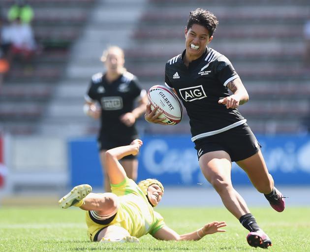 Gayle Broughton of New Zealand makes a break and scores a try during the Cup semi-final between...