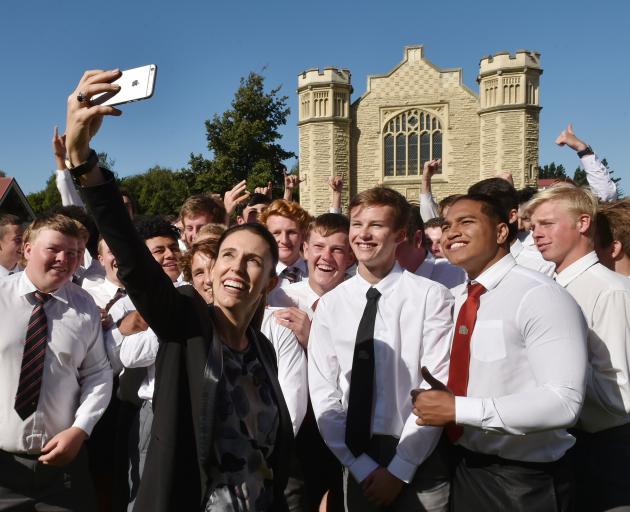 Prime Minister Jacinda Ardern takes a selfie with some very happy Waitaki Boys High School pupils...