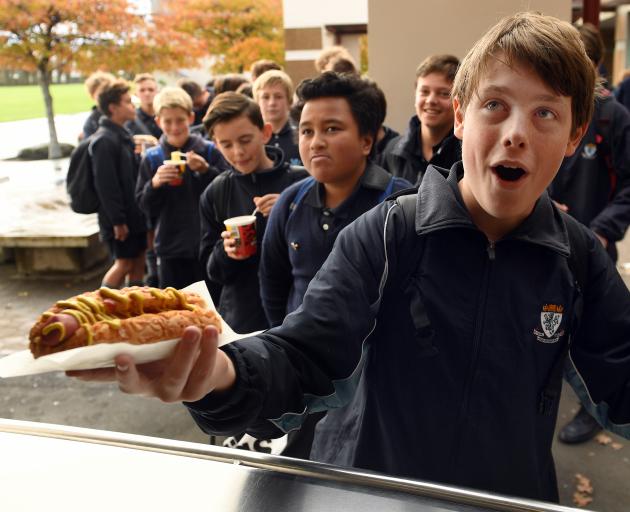 King's High School pupil Zac Bell (14) gets his well-earned lunch at the school canteen. PHOTO:...