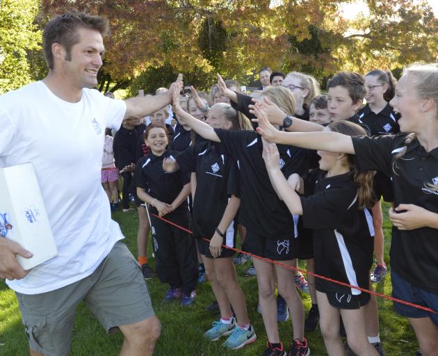 Fairfield School pupils greet Richie McCaw at their school today.. Photo: Gerard O'Brien