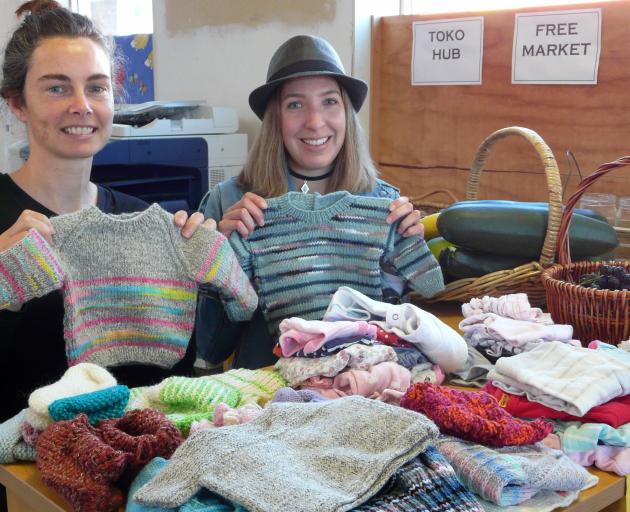 Displaying some of the free and low-cost goods given for the Tokomairiro Community Hub's Monday Market are Project Bruce co-ordinator Lucy Hardy (left) and hub co-ordinator Arna Smith. Photo: Richard Davison