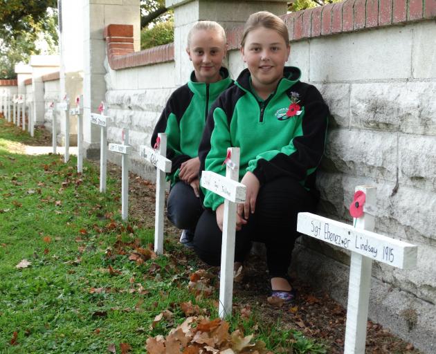 Maheno School pupils Lillie Silcock (11) and Brooke Purvis (11) at the Maheno War Memorial with...
