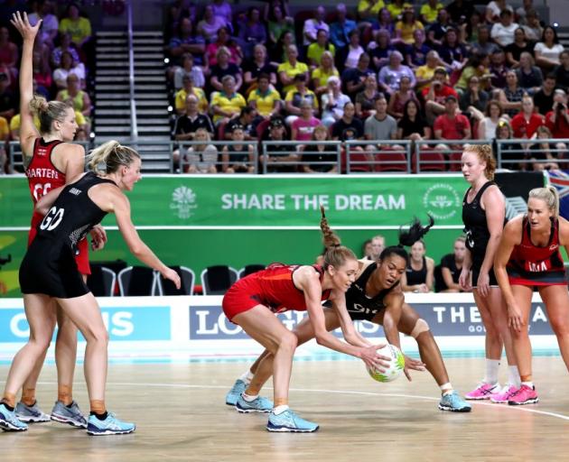 Temalisi Fakahokotau fights with Helen Housby for the ball during the Silver Ferns' match against...