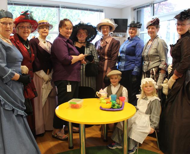 Dunedin Hospital play specialist Jackie Christos (fourth from left) with Images of the Past members (from left) Wilma Graham, Coreen Rodger, Beryl Maultby, Lorraine Clark, Helen Kay, Elsie Sanderling, Rosemary Kelpe, Trudi Boks and (front) Cameron (8) and