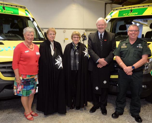 Standing next to the two new ambulances for the Dunedin fleet are (from left) St John Dunedin area chairwoman Annette Tiffen, St John member Joyce Whyman, elected priory chapter member Shirley Hennessy, Rev Dave Brown, and coastal Otago territory manager 