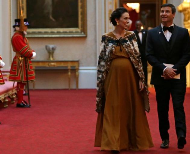 PM Jacinda Ardern and her partner Clarke Gayford at the Queen's dinner last month. Photo: Reuters