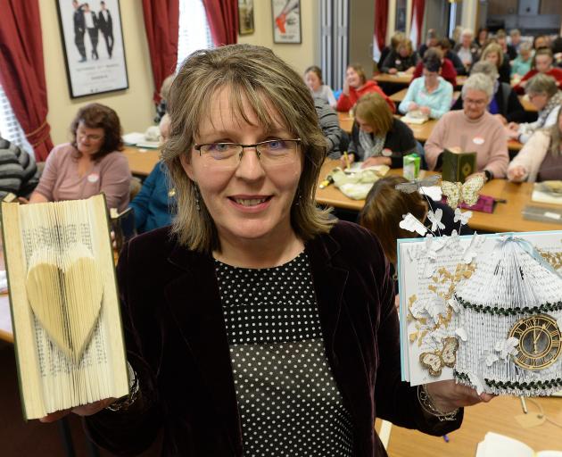 Cathy Fitzsimons teaches budding crafters how to turn books into art at the Regent Theatre on...