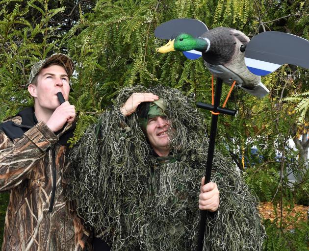 Hunting and Fishing Dunedin employees Riley Bungard (21, left), a self-described "game bird sort...