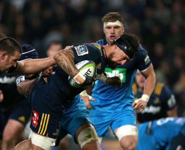 Elliot Dixon carries the ball for the Highlanders against the Blues earlier this season. Photo:...