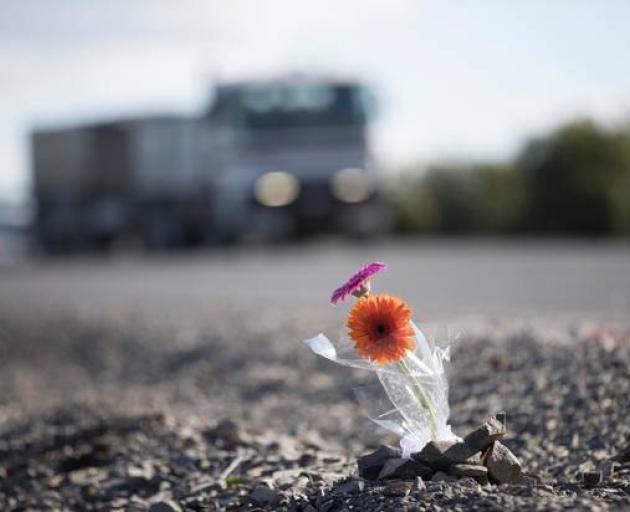 Two flowers form a memorial for the victims of the Kopu bridge fatal crash. Photo: NZ Herald