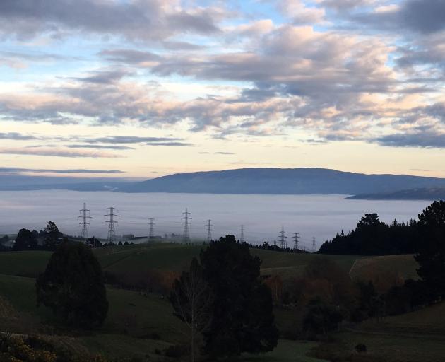 The view of Taieri Plain from Three Mile Hill shows a thick layer of fog has rolled in. Photo:...