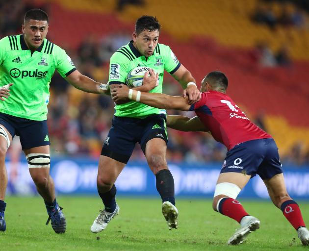 Rob Thompson breaks the line against the Reds in Queensland tonight, Photo: Getty Images