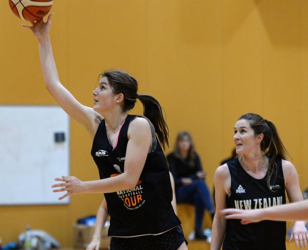Bronwyn Kjestrup looks to score as Natalie Smith watches on at Otago Gold Rush training on...