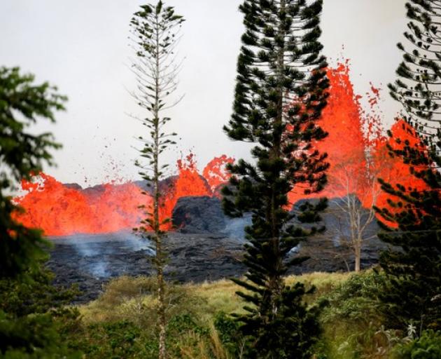 Lava erupts on the outskirts of Pahoa during ongoing eruptions of the Kilauea Volcano in Hawaii