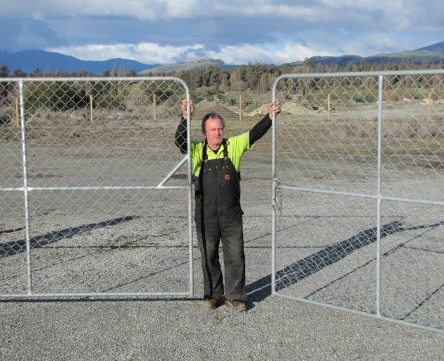 Skip Johnston and the empty yard he had hoped would be full of dry firewood by now.PHOTOS: MARK...