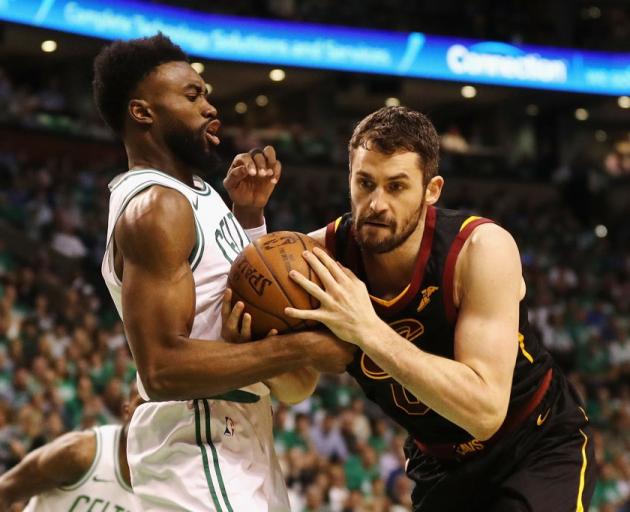 Kevin Love (right) in action for the Cleveland Cavaliers as he is guarded by Boston Celtics guard...