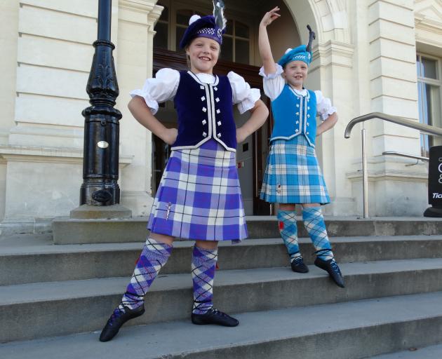 Twins Gemma (left) and Laura Aker (8) pose outside the Oamaru Opera House where they danced in...