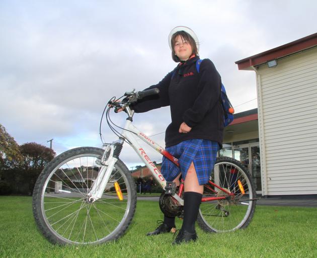 Emma Warden (12) ‘‘just felt like riding’’ her bike to school on Friday, because she was late,...