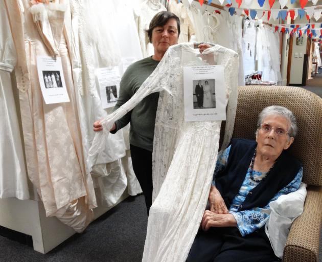 Susan Clark (left) and Evelyn Clarke at Iona Enliven Care Home with the wedding dress they wore...
