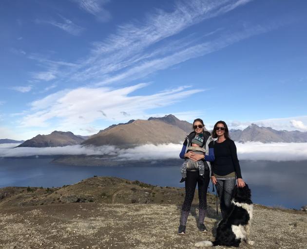 Kate Mitchell, with 9-month-old son Rome, Jodie Lynes and lab-springer Ponti on Queenstown Hill...