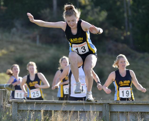 Hill City University's Rebecca Allnutt leads the field in the women's cross country relay race at...