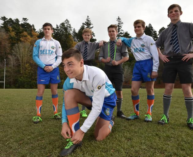 Tying up his laces is referee Logan Whitty (15) while in behind are fellow Otago Boys’ High...