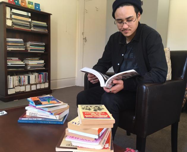 Rape Crisis Dunedin development co-ordinator Angelo Libeau looks over some resources at the organisation’s office this week. PHOTO: KAYLA HODGE