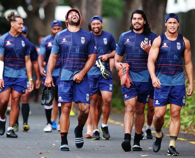 Adam Blair laughs as Tohu Harris (middle) and Roger Tuivasa-Sheck walk next to him at a Warriors...