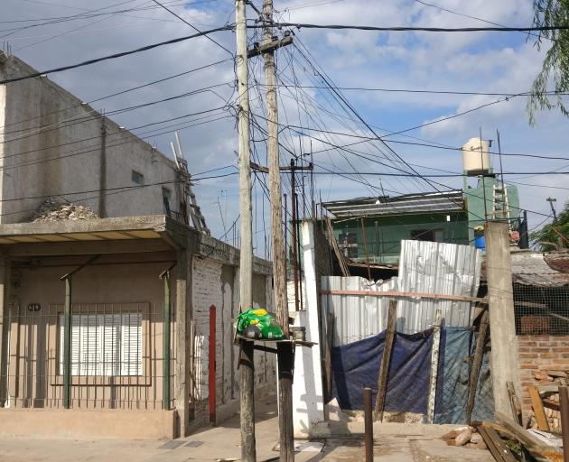 Power cables are strewn across an impoverished residential area in Buenos Aires. 