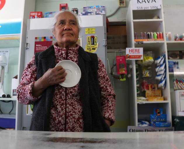 Old Town Store owner Utia Lafita holds the saucer she used to scare off a would-be  robber. Photo...
