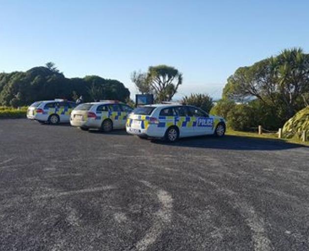 A scene guard is in place this morning at an entrance to Brighton Beach and three police cars are...