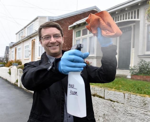 OUSA student support manager Sage Burke says the group is providing free mould-killing solution, comprosed of white vinegar and water, for students. Photo: Peter McIntosh