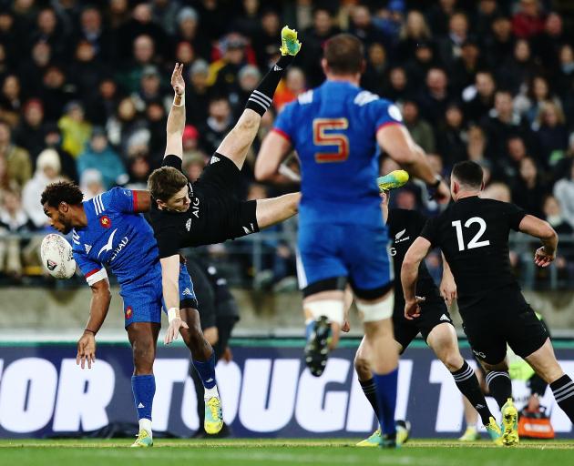 Ben Fall and Beauden Barrett collide as the compete for the ball. Barrett landed heavily on his...