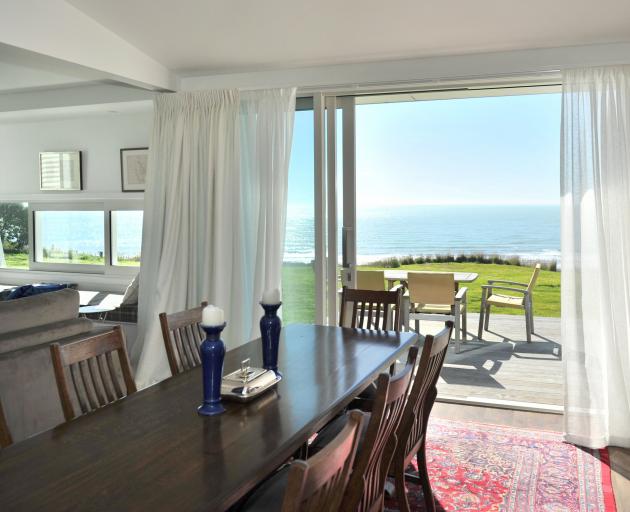 The dining area at the centre of the house leads on to a large deck.
